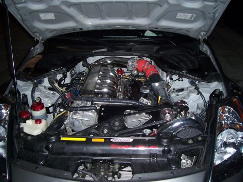 1994 Ford Probe - Customized engine bay a turbocharger setup and performance parts.
