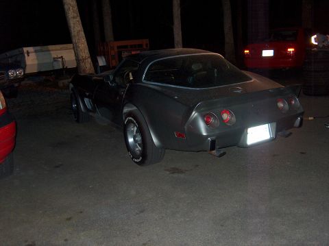 1979 Chevrolet Corvette - This 1979 Chevrolet Corvette is parked outdoors at night, with other vehicles visible in the background.