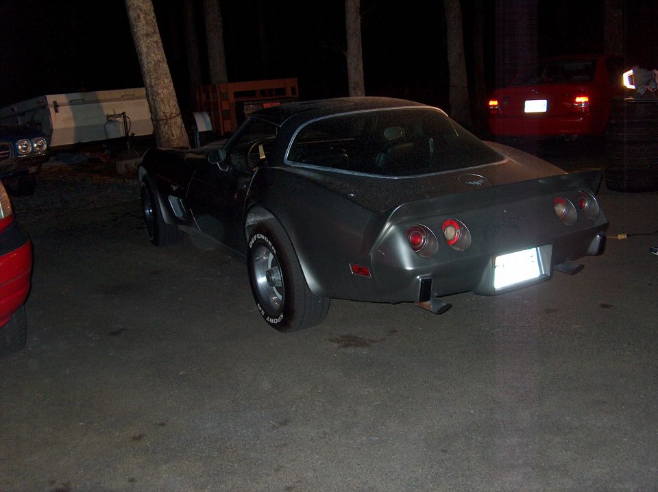 Rear view of a 1979 Chevrolet Corvette parked at night