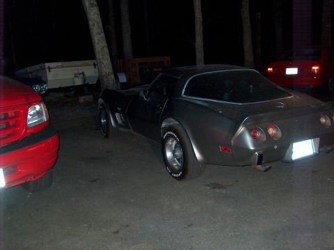 1979 Chevrolet Corvette - A 1979 Chevrolet Corvette is parked outdoors at night, with other vehicles visible in the background.
