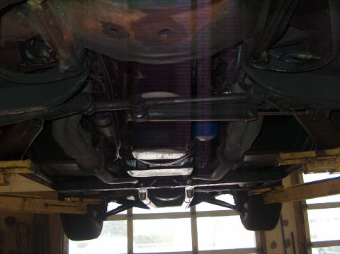1979 Chevrolet Corvette - The underside of a vehicle is captured, revealing the exhaust system and suspension parts, with a Supermotors.net watermark visible.