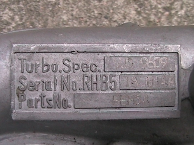 Turbocharger identification plate with Turbo.Spec., Serial No.RHB5, PartsNo. and numbers VJS 9609, 13 D1AA, FEH3A