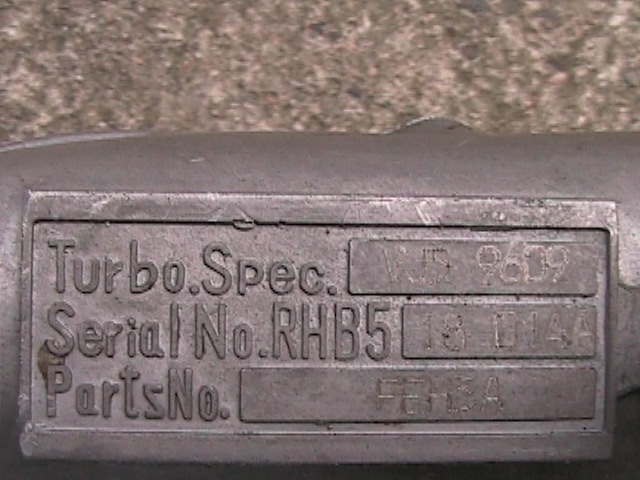 Metal identification plate with embossed text: Turbo.Spec., VJS 9609, Serial No. RHB5, 18 D14A, PartsNo., FEH3A