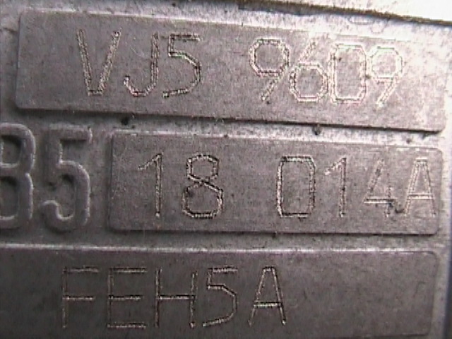 VIN plate with numbers VJ5 9609, B5 18 014A, and FEH5A
