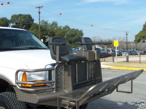 Custom high-rack hunting seat platform mounted over the front of a white Ford truck