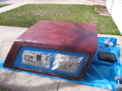 1991 Ford Bronco - Ford Bronco hardtop is taped off and ready for paintwork on a driveway.