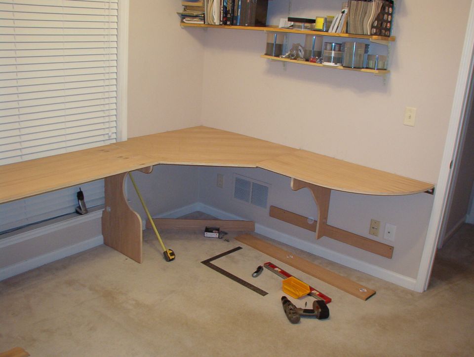 This is my side.  I'll replace that track shelving with built-ins after I finish the desk.