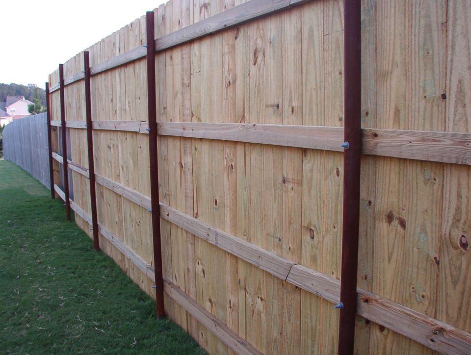 The big part.  It's braced onto the neighbor's fence in 2 places.