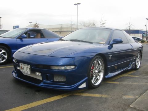 1993 Ford Probe - A modified 1993 Ford Probe is shown in a parking lot with another vehicle nearby.