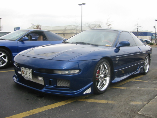 Custom metallic blue Ford Probe GT with body kit and polished wheels