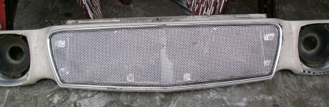 1978 Ford Mustang II - Front grille assembly with headlight cutouts, likely from a 1970s American car.