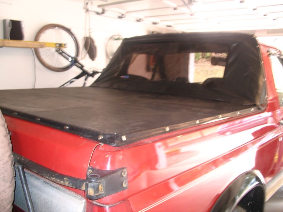 1989 Ford Bronco with black soft tonneau cover, rear view