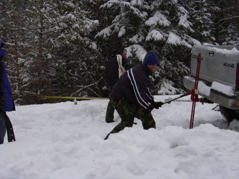 1990 Ford Bronco - Me off to the the left holding the TTB radius arm to use under the hi-lift to prevent it from sinking in the snow.