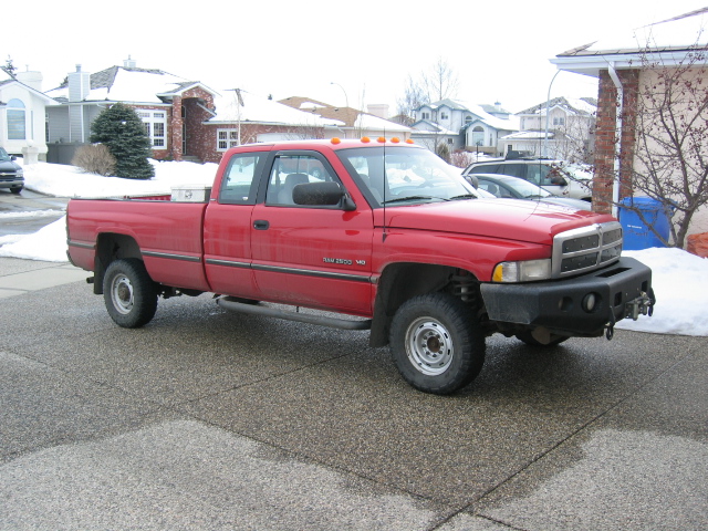 Red 1996 Dodge 2500 pickup truck, 3/4 front view