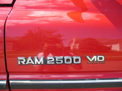 1996 Dodge 2500 - The 'RAM 2500' and 'MAGNUM V10' badges are clearly visible on this red Dodge truck.