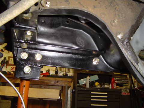 1989 Ford Bronco - Close-up of vehicle frame and suspension components during an axle installation project.