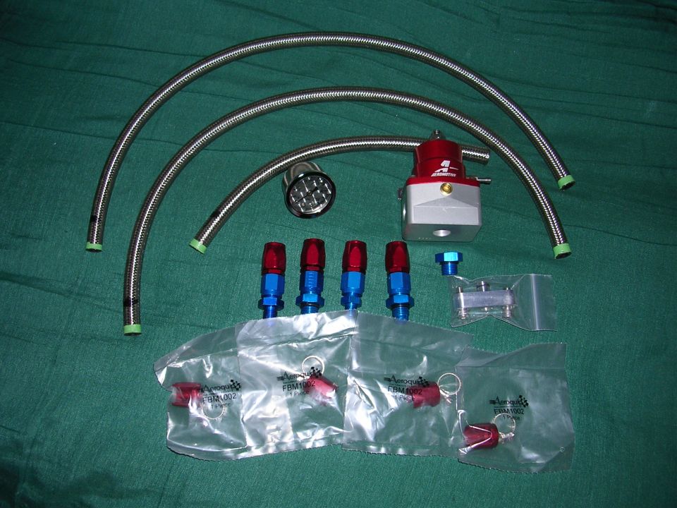 Fuel pressure regulator kit with braided hoses, fittings, and regulator
