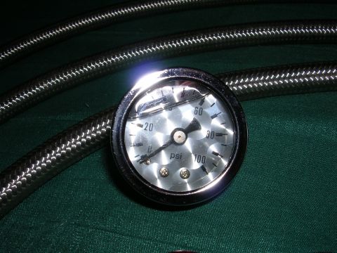 1996 Ford Probe - A pressure gauge with braided hoses is shown, indicating PSI.