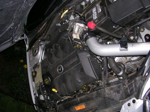 2004 Mazda 6 - Engine bay of a 2004 Mazda 6, showing the V6 engine and intake system.