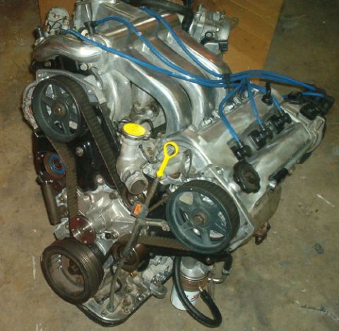 1994 Mazda MX-3 - A V6 engine is shown with its timing belts and spark plug wires.