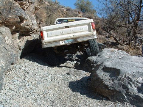 1981 Ford F-150 - This 1981 Ford F-150 is shown off-roading through a rocky, desert-like environment.