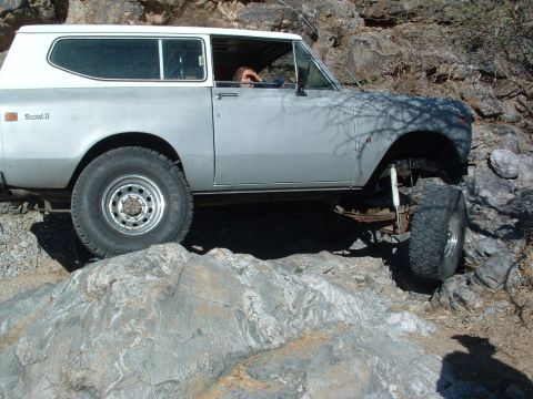 1981 Ford F-150 - This vehicle is navigating a rocky trail, with one wheel lifted off the ground.