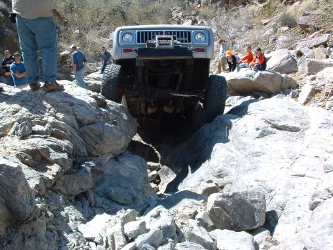 1981 Ford F-150 - An International Scout II navigates a challenging rocky trail, demonstrating its off-road capabilities.