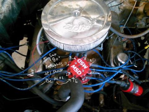 1986 Ford Bronco - Handwritten notes on an engine part suggest incorrect installation of the distributor cap and spark plug wires.