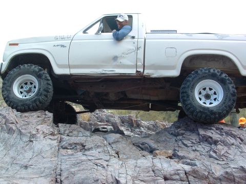 1981 Ford F-150 - Pickup truck navigating a rocky off-road trail.