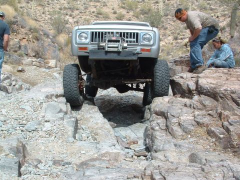 1981 Ford F-150 - An International Harvester Scout II tackles a difficult rocky trail in the desert.