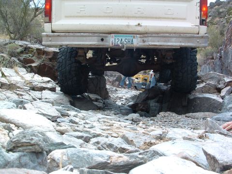 1981 Ford F-150 - This 1981 Ford F-150 is shown off-roading through a rocky landscape, demonstrating its capability on challenging terrain.