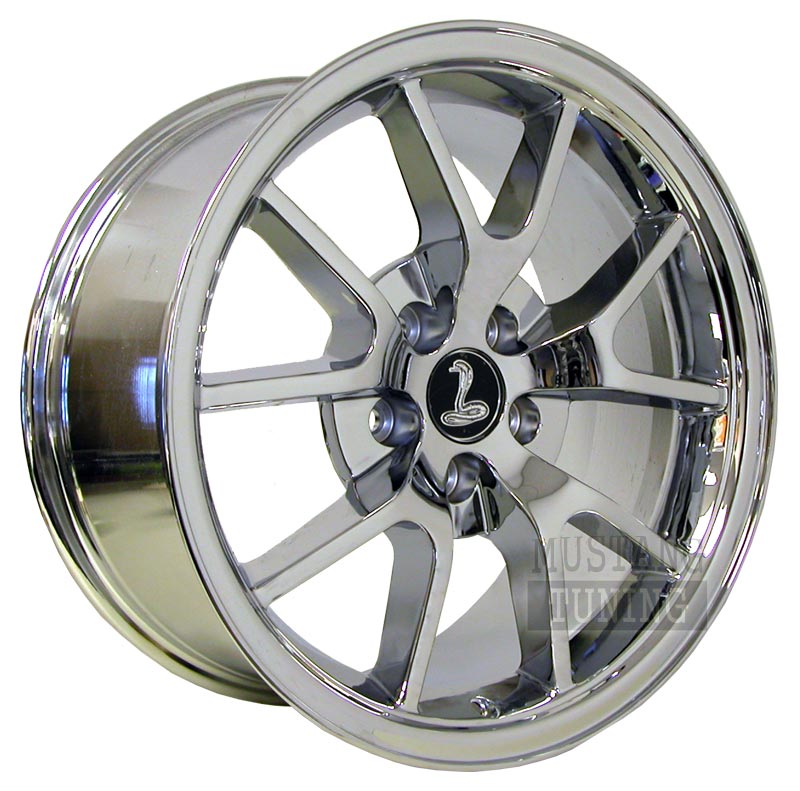 Chrome FR500-style Mustang wheel with Cobra center cap on white background