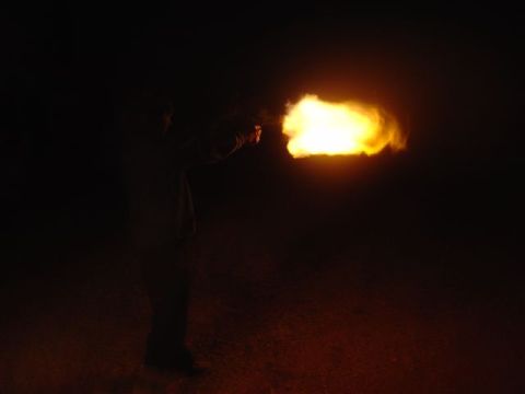 1981 Ford F-150 - A person fires a bright orange flare into the darkness, illuminating the night sky.