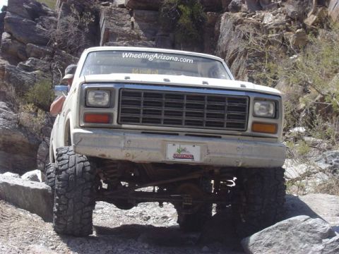 1981 Ford F-150 - This 1981 Ford F-150 is captured from the front, navigating a rocky off-road trail.