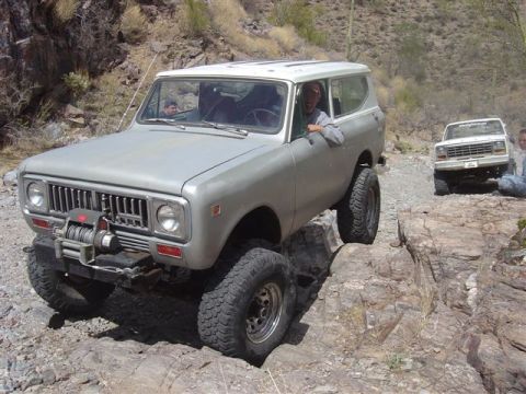 1981 Ford F-150 - An International Harvester Scout II navigates a rocky trail, with another truck visible in the background.
