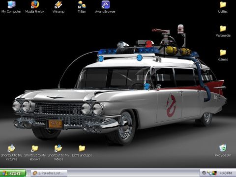 1991 Ford LTD Crown Victoria - A Windows XP desktop screenshot whose wallpaper is a 3/4-front render of the Ghostbusters Ecto-1, a white 1959 Cadillac ambulance/hearse co…