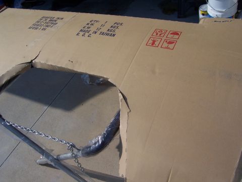 1978 Ford Bronco - A flattened shipping carton on a concrete driveway stenciled "QUARTER SKIN 78-79 BRON, QTY 1 PCS, MADE IN TAIWAN R.O.C." with part numbers…