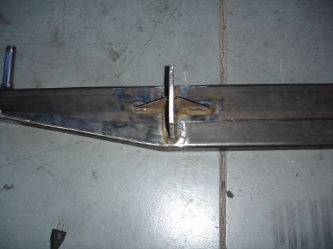 1996 Ford Bronco - A close-up view of a metal frame section with a welded bracket and pin, the Supermotors.net logo in the corner.