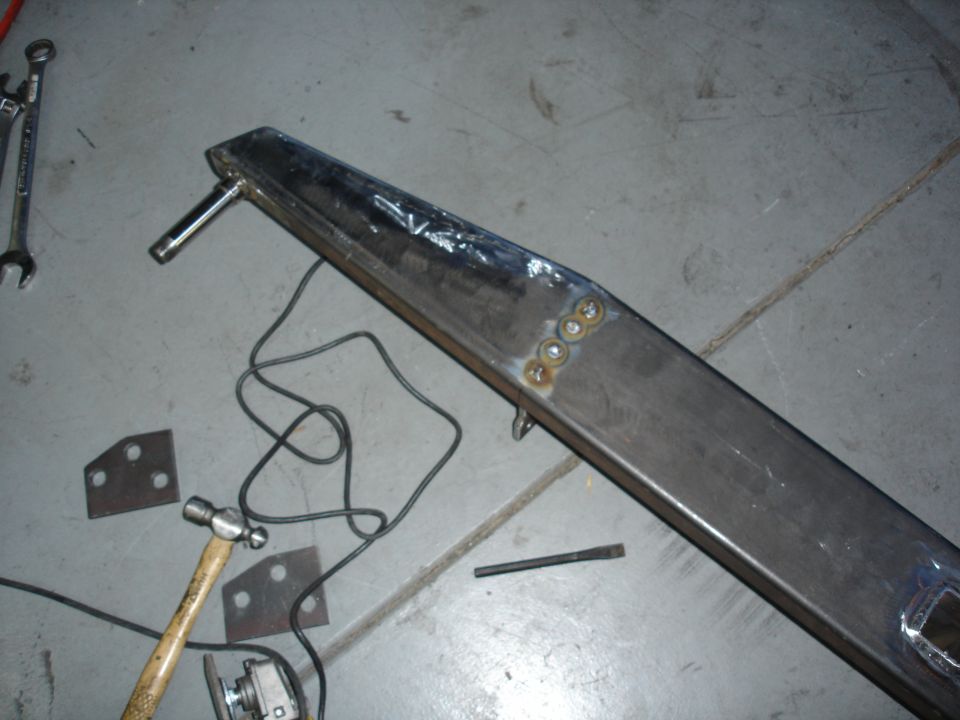 This picture shows the plug welds through the front of the bumper for the brackets