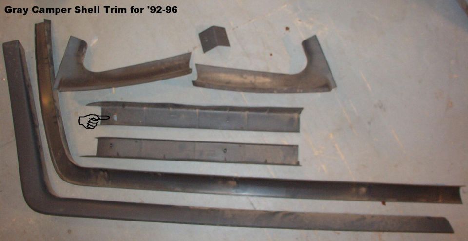SOLD Dark Gray Camper Trim from '92-93 Bronco

Fits '92-96.  Screws (5) & some pushpins (~10) included.  The damaged screw hole indicated has been glued back into place.

Ships as 64x25x6" @ 7lbs.