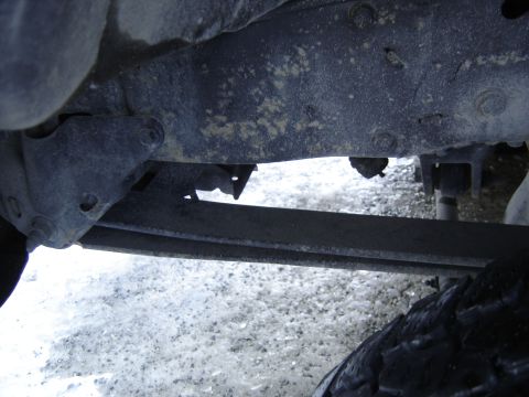 1988 Ford Bronco - Close-up view of the undercarriage, showing the frame and suspension components.