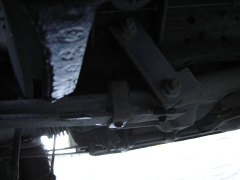 1988 Ford Bronco - The underside of a vehicle is shown, with suspension parts and a website watermark visible.