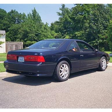 1989 Ford Thunderbird - This 1989 Ford Thunderbird is shown from a rear three-quarter angle on a sunny day.