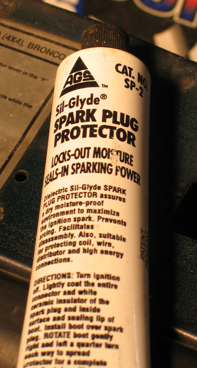 1994 Ford Bronco - A bottle of Sil-Glyde Spark Plug Protector is shown, with directions for use printed on the label.