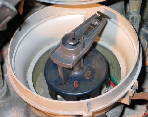 1994 Ford Bronco - Close-up view of a vehicle's ignition distributor cap and rotor.