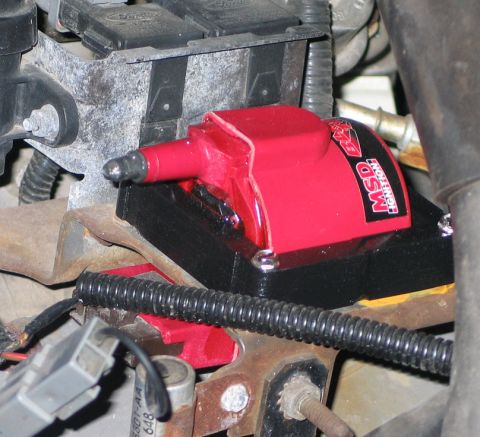 1994 Ford Bronco - Close-up of an aftermarket MSD ignition coil, part of the vehicle's ignition system.