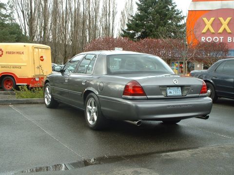 1999 Ford Crown Victoria - Rear view of a gray Ford Crown Victoria Marauder parked in a lot.