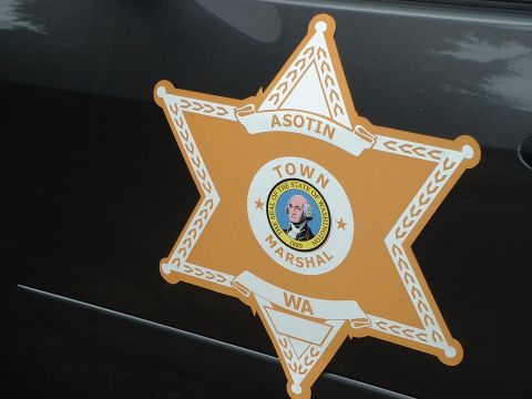 1999 Ford Crown Victoria - Close-up of a Town Marshal badge on the side of a vehicle.