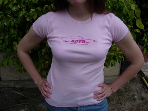 1998 Ford Crown Victoria - A person wears a pink t-shirt with a car graphic and website address printed on it.