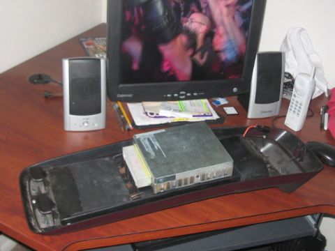 1991 Ford Bronco - Computer components and peripherals are arranged on a wooden desk surface.